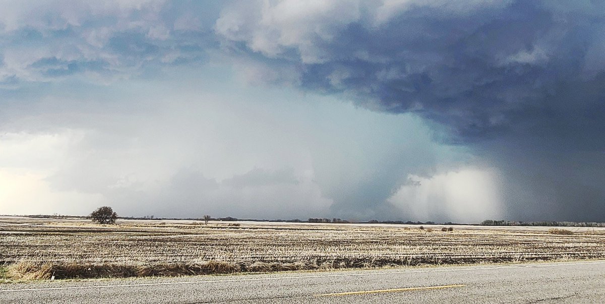 2 Edited Photos showing what we believe is a funnel cloud touching down west of Hamiota on Wednesday May 10.  What do you think?  #mbstorm #mbwx #funnel
#westman