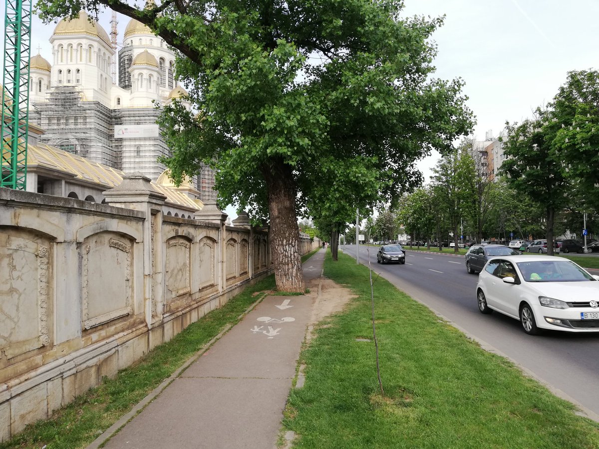 What about this one @MobileHarv?
2x3 lanes for cars and a single shared pedestrian + bike + tree lane alongside the palace of parliament in Bucharest
