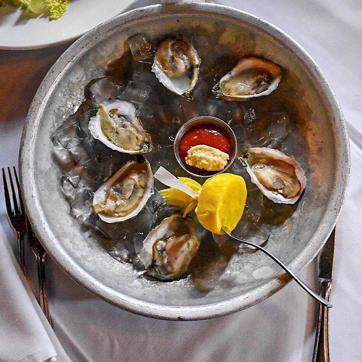 Take a dive into the briny depths with our Ostriche al Limone! These shucked beauties are a seafood lover's dream. 🦪
 #supportlocalbusiness #foodandwine #virginiafoodies #visitalx #zagat #saveur #huffposttaste #italiancuisine #onlineordering