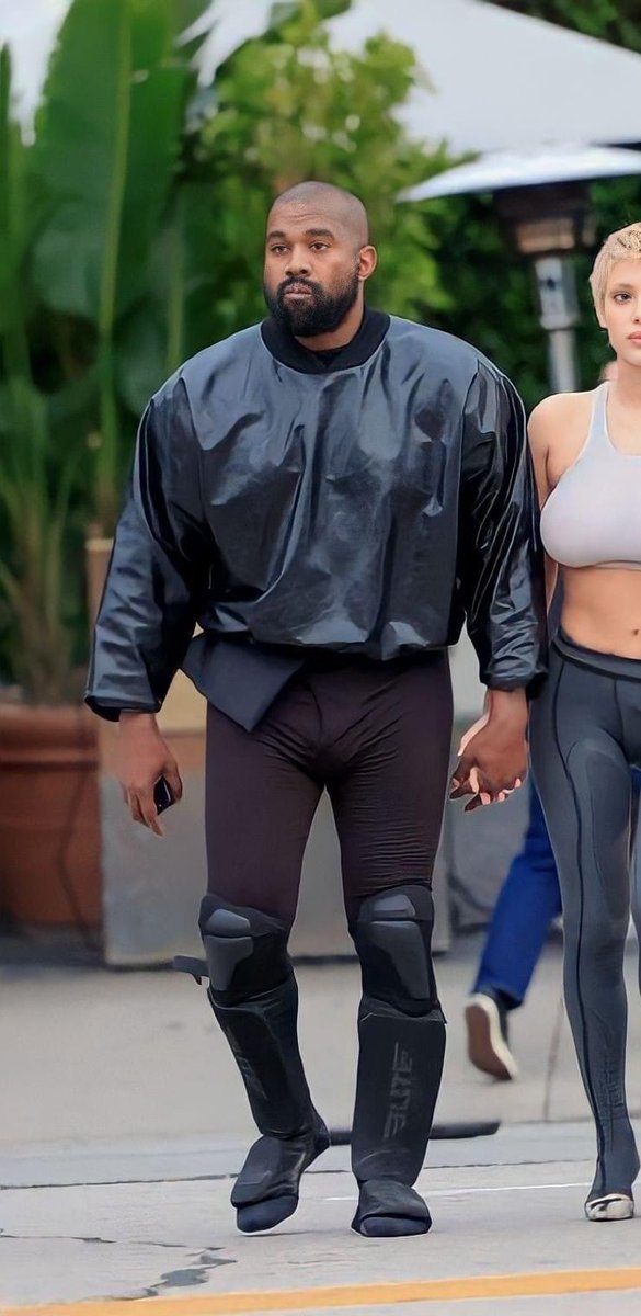 DerekBrunson's tweet photo. Why Kanye walking around town with Muay Thai shin guards on 😂😂😂 https://t.co/cNz71PaXEY