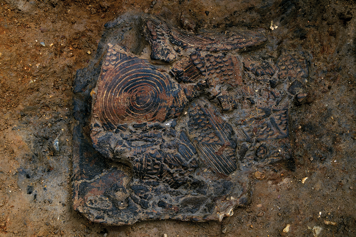 We’re thrilled to have uncovered this stunning decorated Grooved Ware vessel in the bottom of a pit at the <a href="/Hanson_UK/">Bill</a> Needingworth quarry. Dating to approximately 2900-2400 BC, the pot was probably placed in the pit whole and collapsed from the weight of soil above it. More soon.