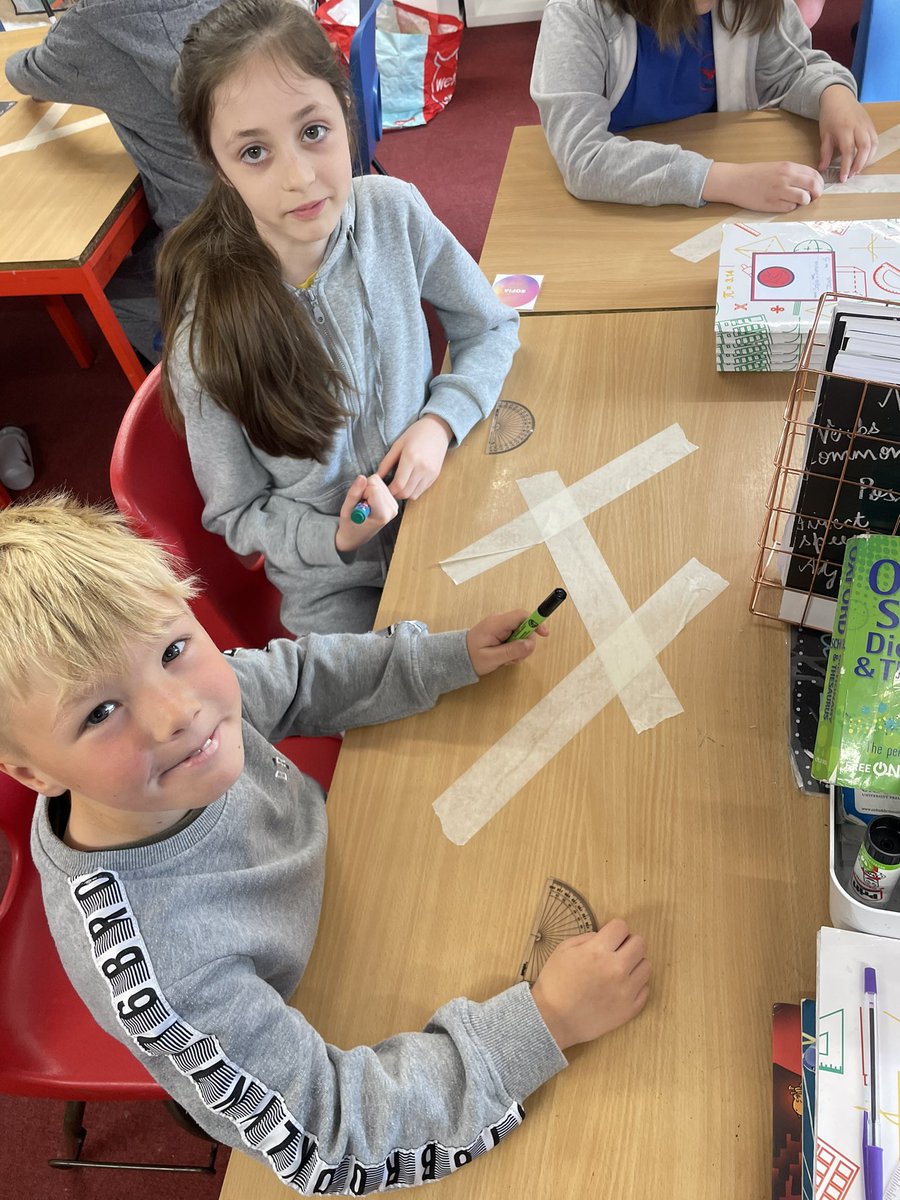 MaundeneSchool's tweet image. Jays started their learning today off by measuring angles. They had to work together to measure the angles created by the masking tape! #practicalmaths