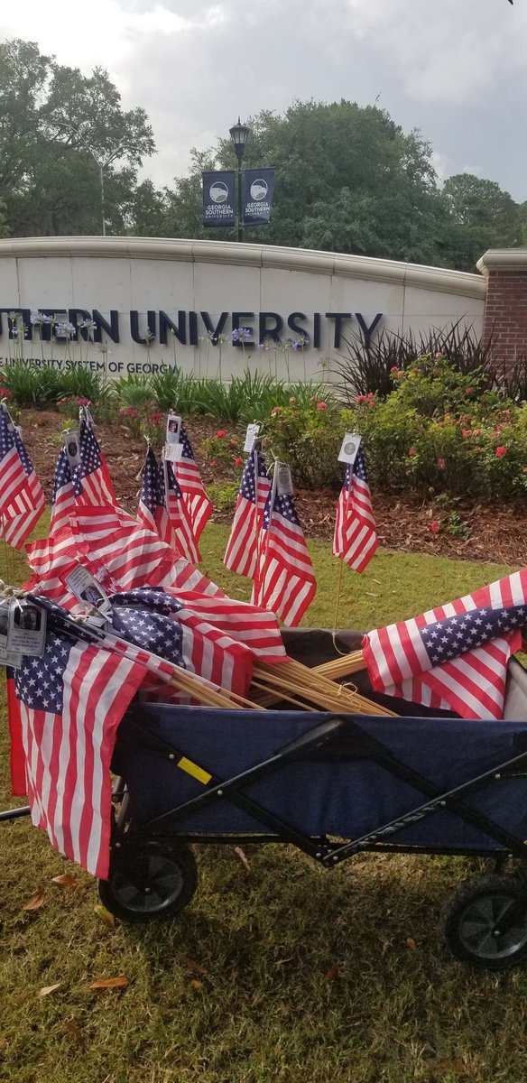 JohnCLester's tweet photo. Flags started going out today on @GeorgiaSouthern's Savannah campus in advance of Memorial Day. It's a moving sight. #NeverForget https://t.co/IooqMRPMRV