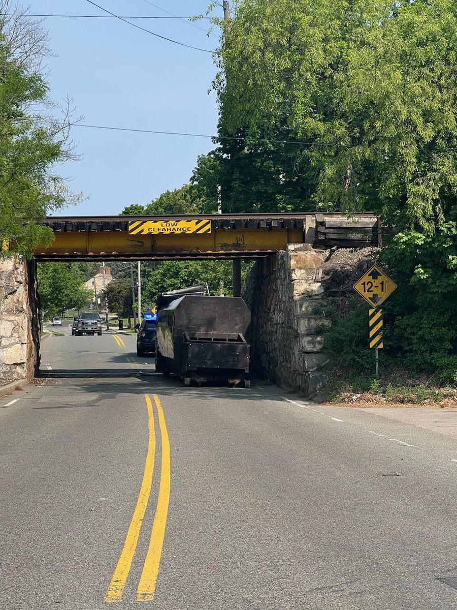 DedhamPD's tweet photo. Traffic Alert Update: All traffic will be detoured away from the bridge. MBTA also reports all train service halted while engineers inspect the damage. Please seek alternate. https://t.co/zU5WFcg28b