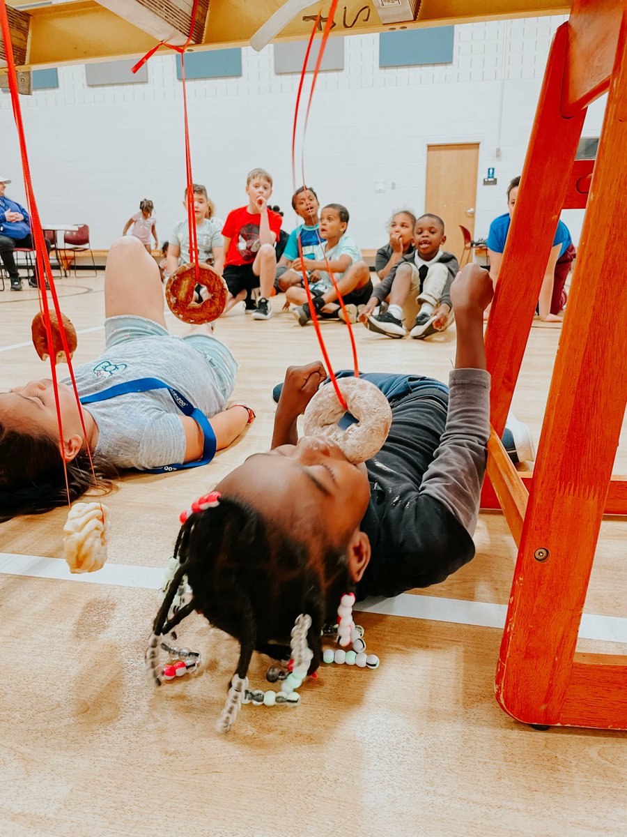 SArmyKZO's tweet photo. Hey there! Our youth program had a hilarious and messy time eating donuts from a string last week! Watching the kids try to devour the treats without using their hands was a sight to see! We love finding fun and creative ways to bring our youth together and encourage teamwork https://t.co/UDdP2YWv0r