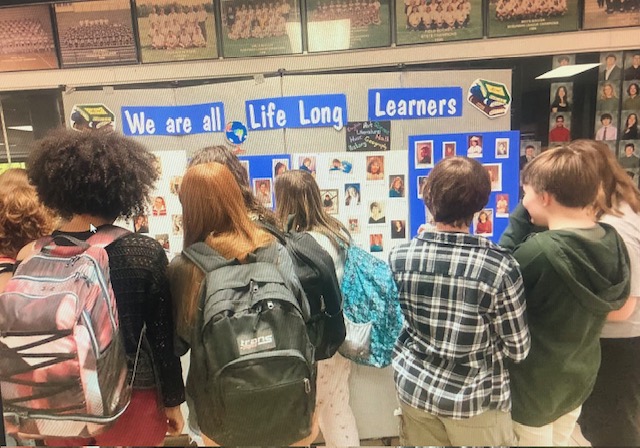 Portrait of an Explorer Day - We are all Life Long Learners! During lunch today, check out the High School Graduation Pictures of many HHS Teachers and Staff Members.