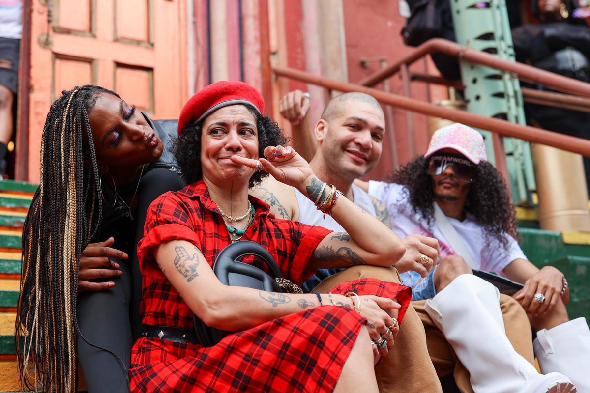 humansofny's tweet photo. “It can feel like hamster wheel shit. My mental health gets in the way. I forget there’s a sun sometimes. But if I died today, my testament would be my community. It’s this huge queer community. Every color of the fucking rainbow. Every gender, every race, every orientation. Right now we’re having a memorial for our friend Tommy. Biggest queen ever, beautiful. Most everyone here has had to walk through life with difficulties. The way they present themselves hasn’t always been seen, or respected, or honored. But they’re still unapologetically existing. And they’re giving a lot of love. They might not have been shown a lot of love, but they’re giving a lot of love. No gender bias, no race bias, no financial bias. All they see is flesh, blood, and a fucking soul. I’ve walked among some of the most beautiful humans on earth. I forget that sometimes. I need to be more respectful of that. I’m living a life that a lot of people want. I’m surrounded by love.”