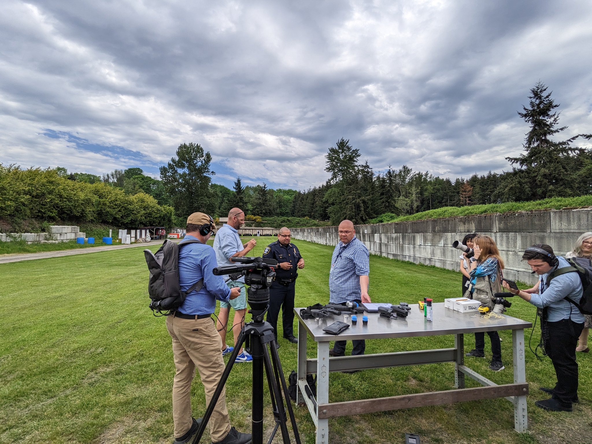Adrian Diaz and members of the press at the police gun range 