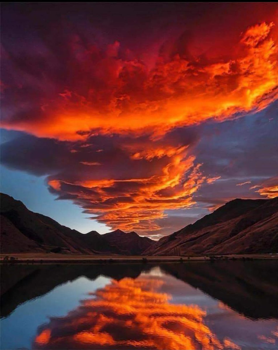 Breathtaking sunset with fiery colors at Moke Lake, near the suburb of Closeburn in Queenstown, New Zealanf