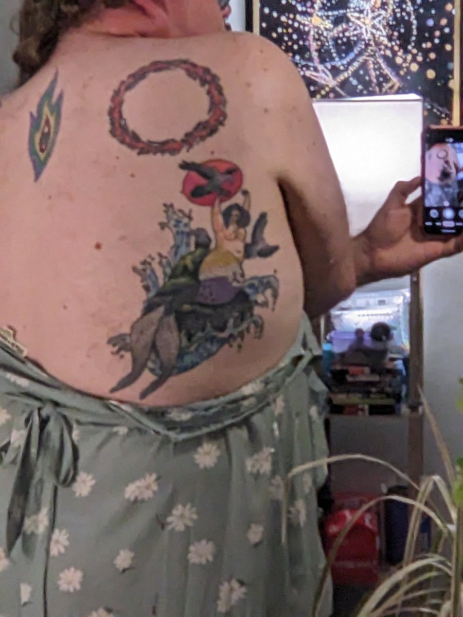 Showing off my tattoos... I had to lower my dress... So vulnerable... So naked... Would you want to ask to see my tattoos in person? What would you do if I was so vulnerable right near you?