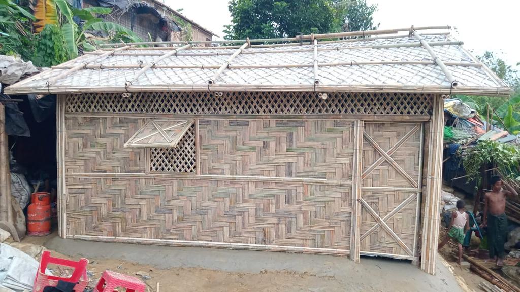 resty_lou's tweet photo. Remember the big fire in #Camp 11 last March that bunt more than 2800 houses? @BDRCS1 @ifrc resume the construction today. After prioritizing the distribution of emergency shelter materials yesterday for families with damage shelters due to #CycloneMocha. https://t.co/oaK1YYVTmq