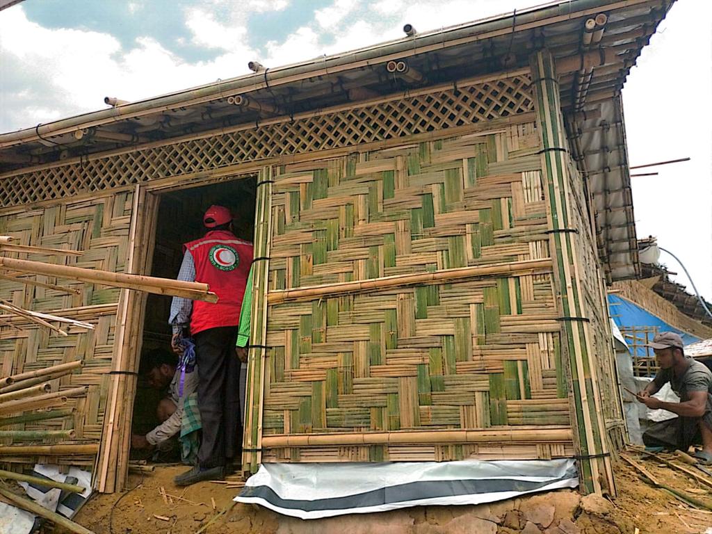 resty_lou's tweet photo. Remember the big fire in #Camp 11 last March that bunt more than 2800 houses? @BDRCS1 @ifrc resume the construction today. After prioritizing the distribution of emergency shelter materials yesterday for families with damage shelters due to #CycloneMocha. https://t.co/oaK1YYVTmq