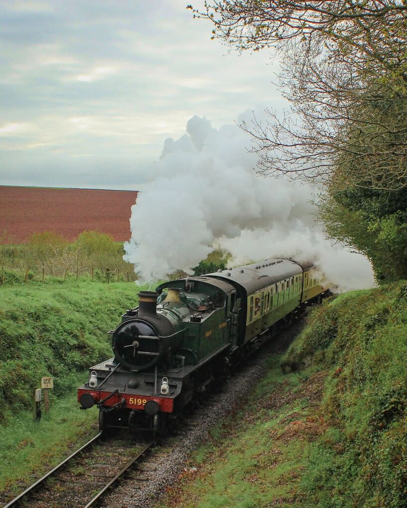 AdamJohnAshford's tweet photo. Prairie Power. 

GWR 5101 Class No 5199 climbs the gradient towards Crowcombe Heathfield at Combe Florey with its local train for Williton during the West Somerset Railway Spring Steam Spectacular.

#trainsofinstagram #trains #train #uksteam #uksteamtrai… https://t.co/6CBEwJadLO https://t.co/RIY11PVVbw