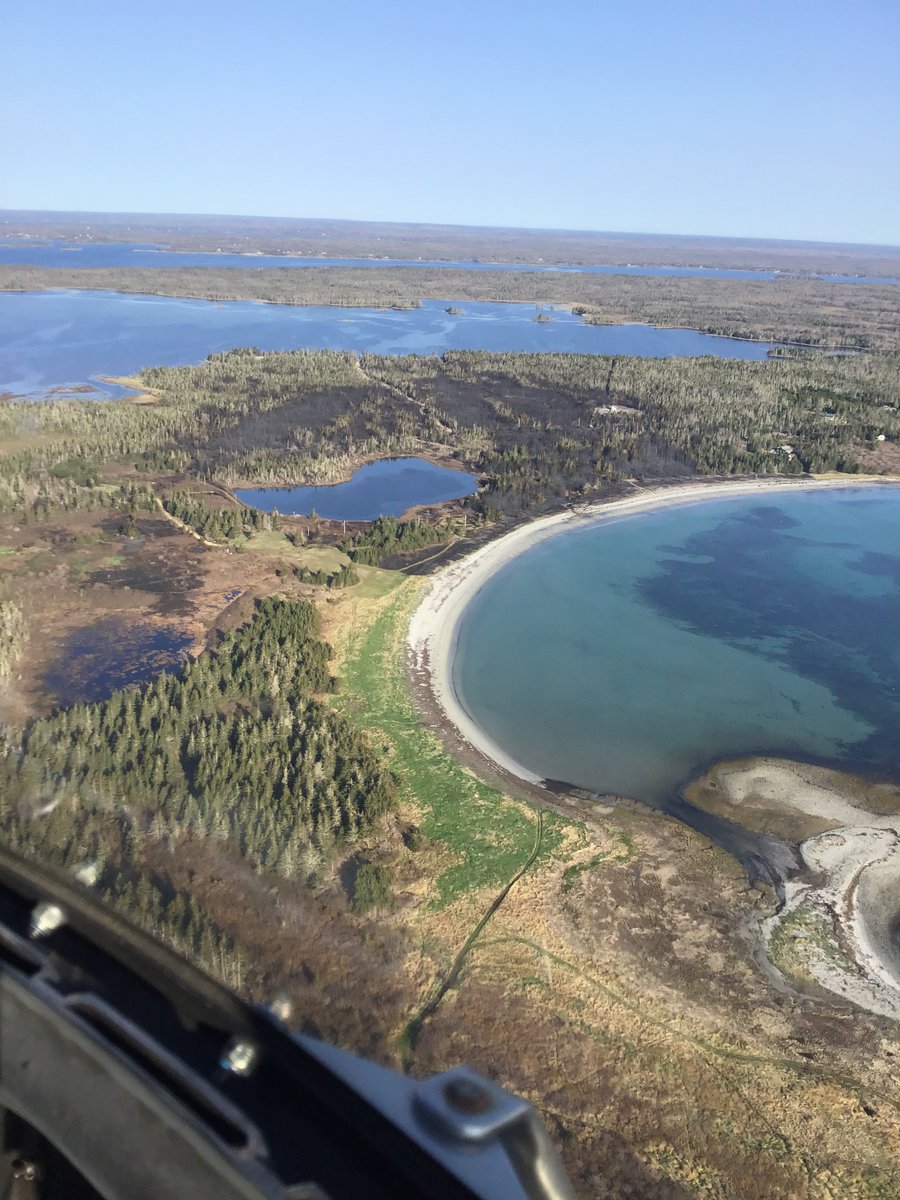 NS_DNR's tweet photo. (1/2) Little Harbour, Shelburne Co. update (10am): wildfire is 25% contained. It’s being held at 56.5ha. 30 DNRR staff, 8 vol. firefighters &amp; 1 helicopter on site. See next update here after 12 pm. https://t.co/fThUaHdlHC