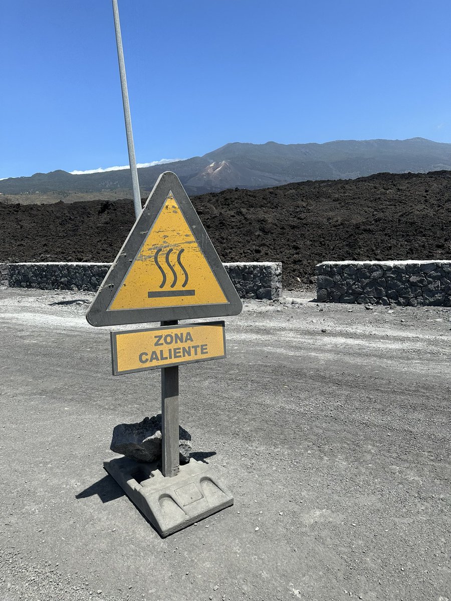AmandaBClarke's tweet photo. Bumpy new road over 2021 Cumbre Vieja lava flows. New cone in distance. Thanks CERG-C Geneva. #seseasu https://t.co/rgE8VBE7WU