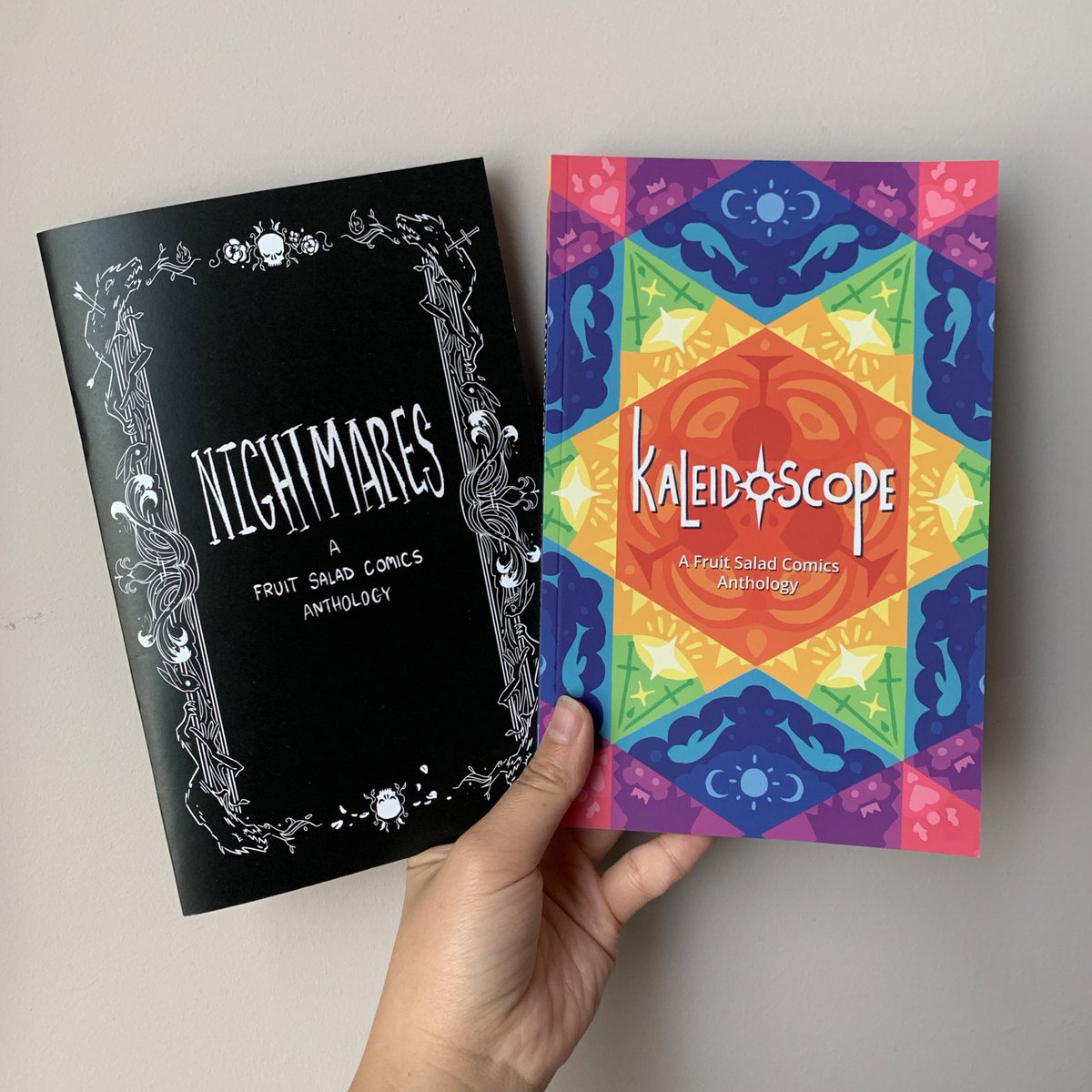 Hey VANCAF goers, be sure to visit Fruit Salad Comics booth at J06 (the gym) this weekend! 
We’ll have our two anthology creations- NIGHTMARES and KALEIDOSCOPE - for you to behold in person. Just look at them 🖤🌈