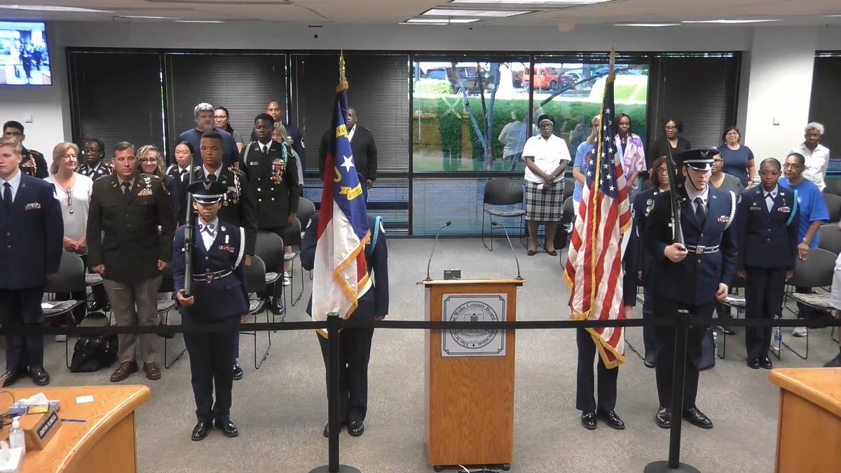 nckhui's tweet photo. .@SpartanTweets Air Force Junior ROTC unit presents the colors for the Pledge of Allegiance at today's Wake County school board meeting. Board is getting a highlight of the district's JROTC programs today. #wcpss #nced https://t.co/x77GSdgOI3