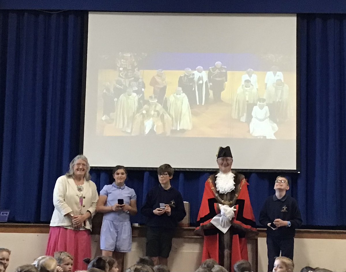 GCA_learning's tweet photo. The Mayor and Mayoress of Godmanchester attended our assembly today to present the children with a special commemorative medal to mark the coronation of King Charles III. We learnt about the Fleur de Lys and some of the history of Godmanchester #GCAcommunity https://t.co/qMHcM1pWdb