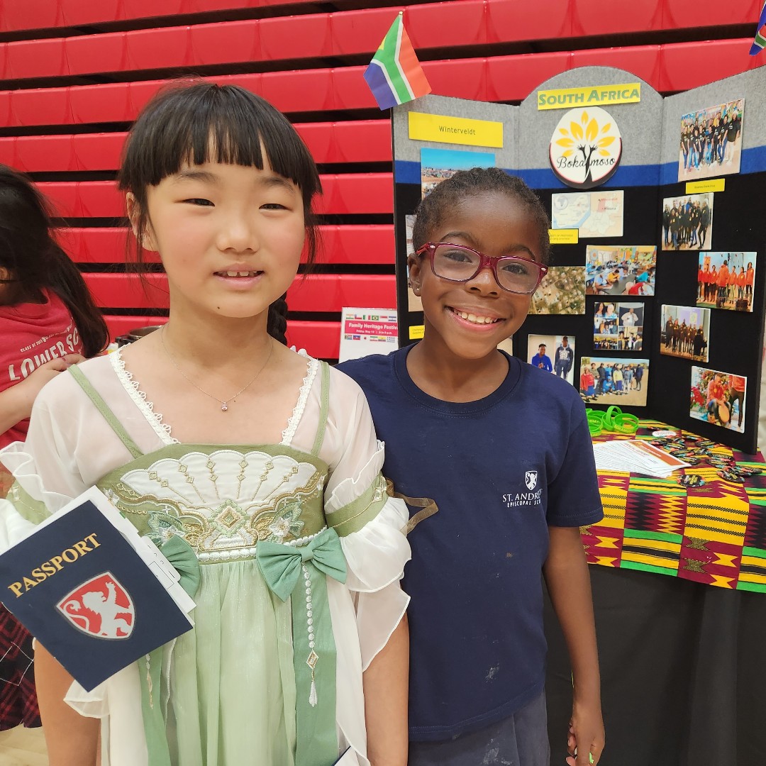 SAES's tweet photo. Lower School students enjoyed a trip around the world - from the convenience of Lions Court - during the Family Heritage Festival. Thank you to the many families who represented a variety of countries and cultures through decorated tables, food, activities, and performances. https://t.co/RUzz7sivPO