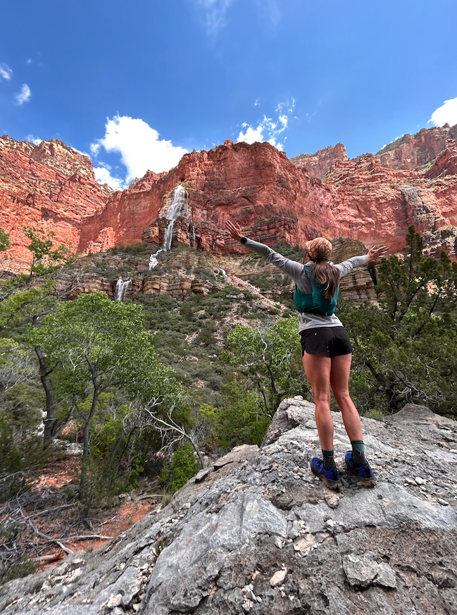 After a long hike, celebrating the breathtaking view of Cheyava Falls. It's an intermittent 800-foot waterfall in Grand Canyon that's fed by North Rim snowmelt.