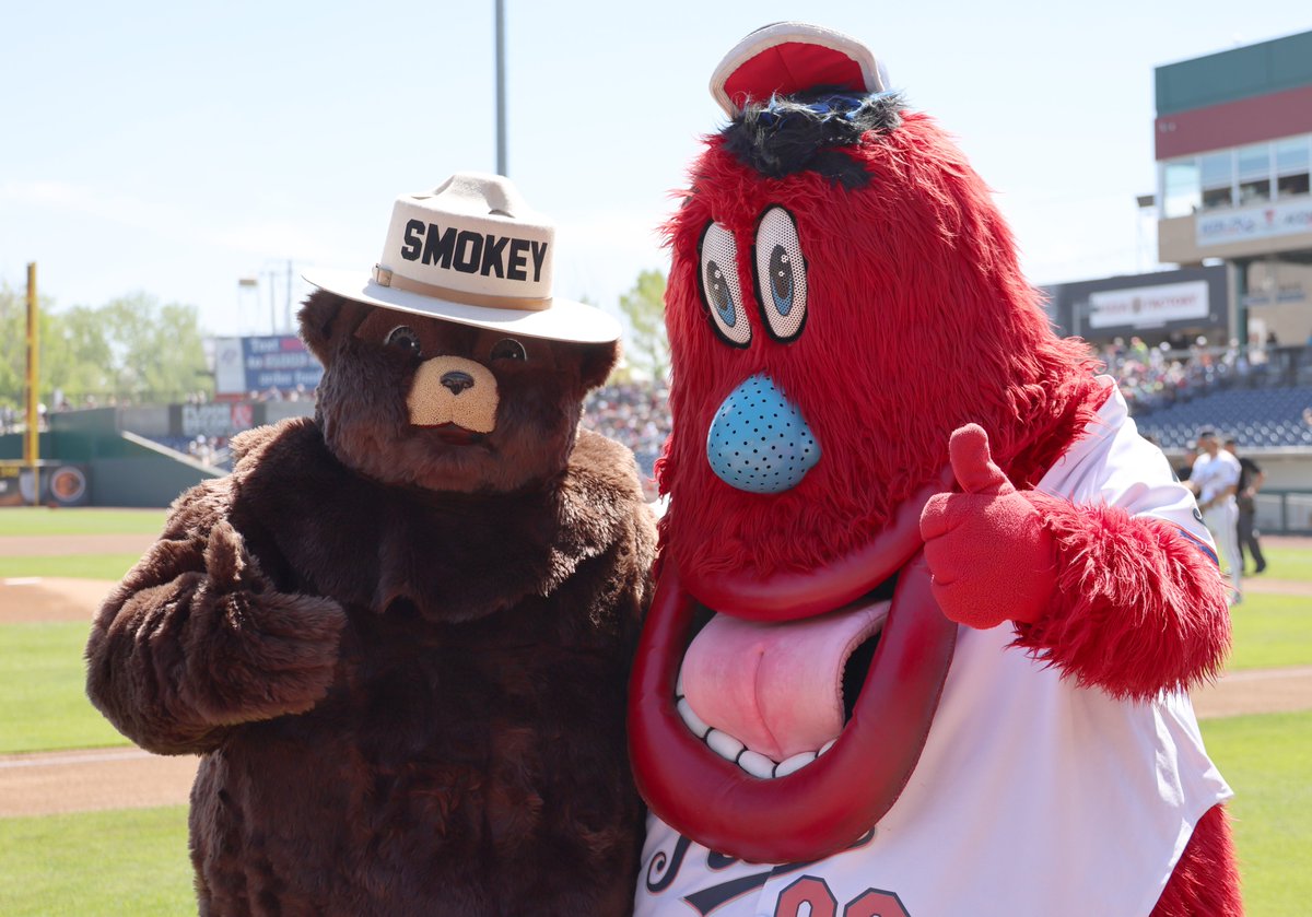 HumboldtToiyabe's tweet photo. #SmokeyBear @ Reno Aces Education Day on May 16. While waiting to throw out first pitch, he posed with 2022-2023 Nevada State Teacher of the Year Connie Hall & Aces Mascot Archie. Wildland Firefighters on #CarsonRD escorted Smokey and staffed a booth. @forestservice @Aces https://t.co/6mKlq7JzzB