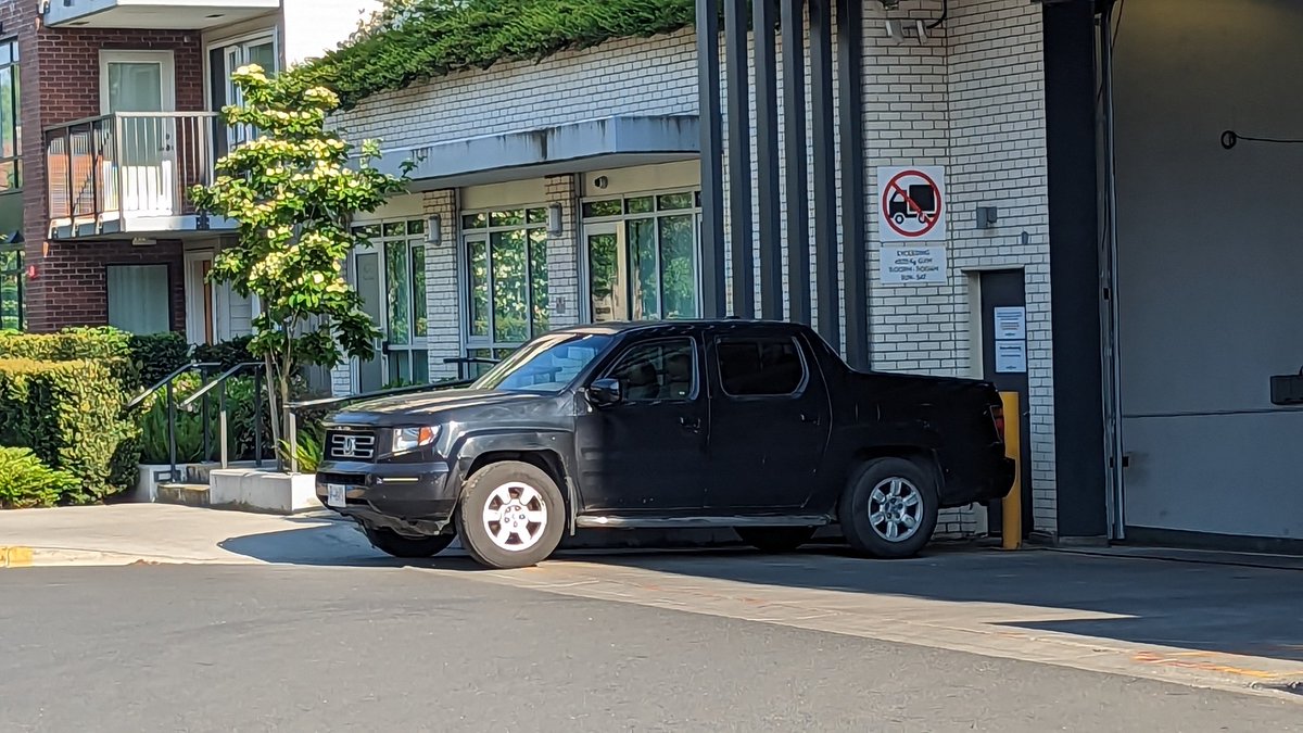 VicSidewalkFail's tweet photo. Empty truck parked across the entire sidewalk in #yyj. Literally parked on the sidewalk, what a tool. Also lol that the driver could have parked in the free parkade that is RIGHT THERE but parked on the whole ass sidewalk instead. https://t.co/sePPN1sXAG