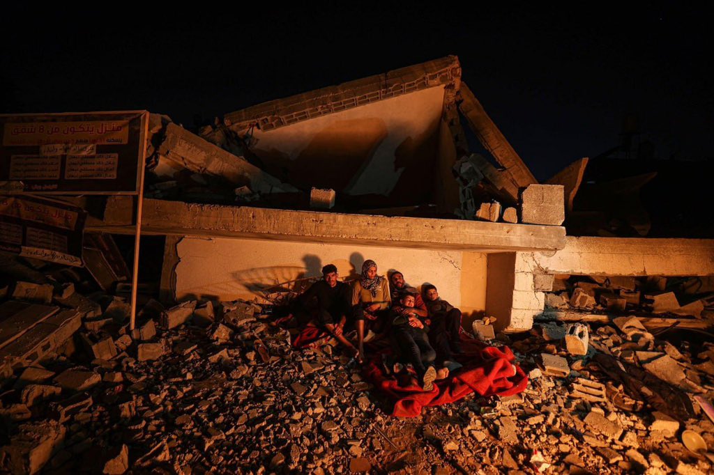 Timesofgaza's tweet photo. After becoming homeless, Palestinian family sleep on the rubble of their house that has been bombed by lsraeli warplanes in the latest aggression on Gaza Strip. https://t.co/uVOALay7Sr