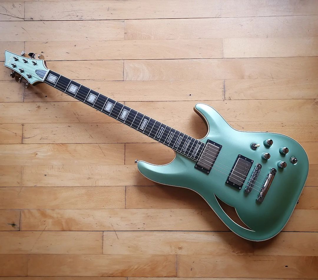 I'm currently swooning over this new Schecter C-1 E/A semi-hollow. Apart from the stunning looks, it was the inclusion of a Fishman Power Bridge, for those acoustic tones, that really grabbed my interest. This thing has a huge range of tonal options. And it feels great to play!