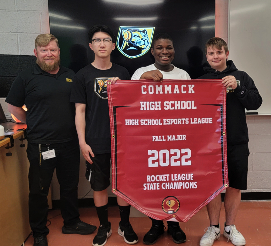 CommackSchools's tweet photo. The 2022-23 Esports Rocket League State Champions have received their banner! Congratulations to Brian S, Alvin L, and Dan F for their accomplishments this season. The banner will be hung proudly in the Gaming Den. The #Esports program continues to flourish at CHS. Go #CyberCats! https://t.co/9hXsCYWDGc