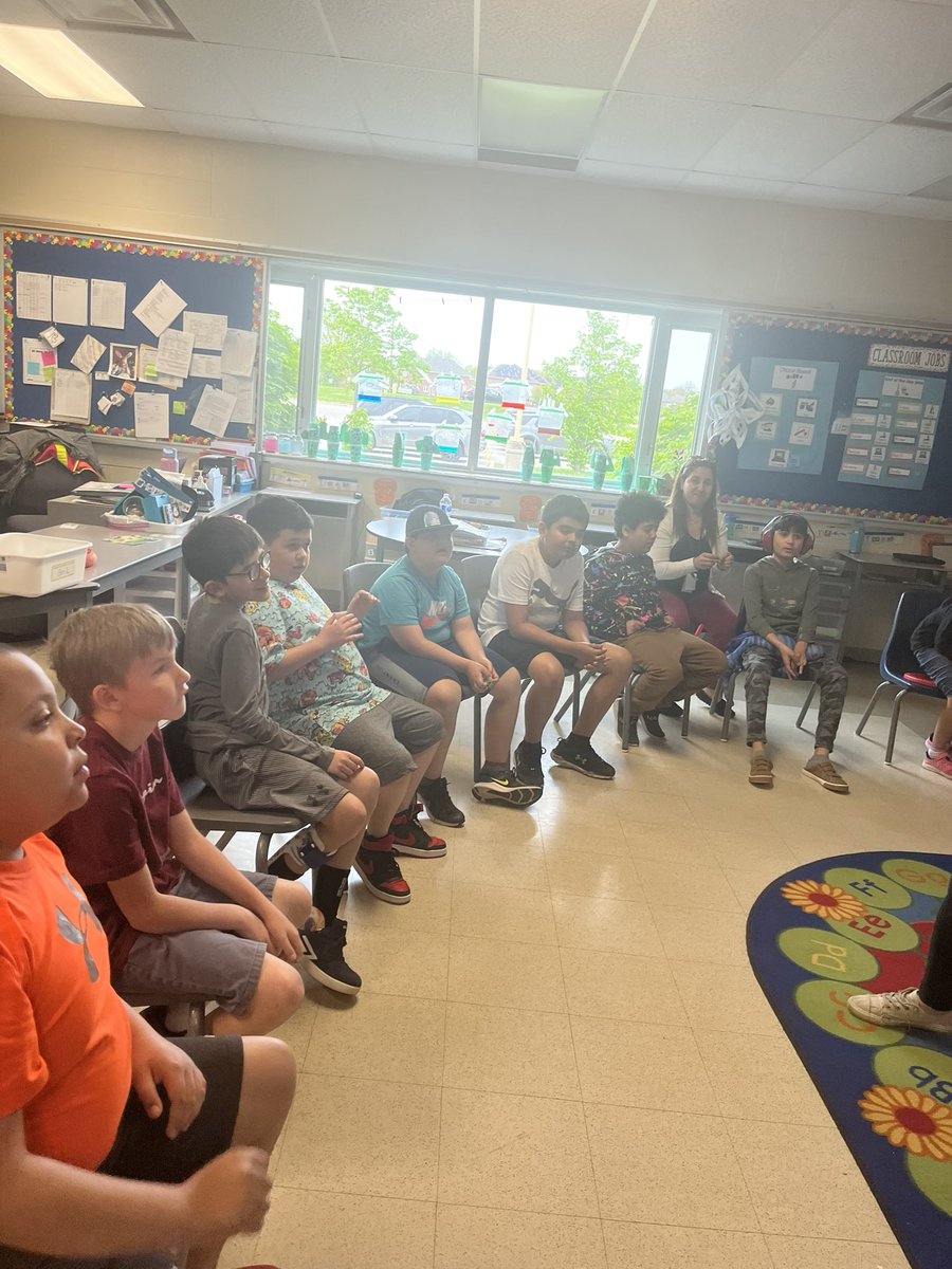 MsCormier1's tweet photo. Our visit with officer Luke yesterday! We had some great discussions around fire safety!  Mrs . Mac and myself also got to try on the gear, and boy is it heavy! @ALXCoyotes https://t.co/A70ZXOsuCU