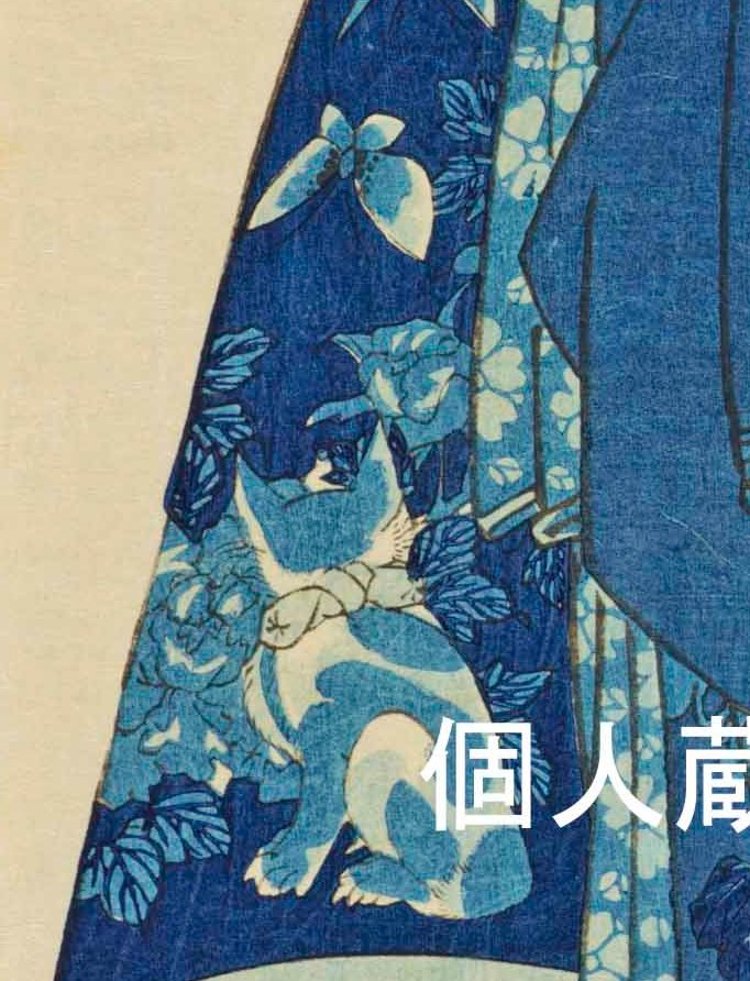 蝶を見つめる猫の後ろ姿。遊女の帯に表されたものです。猫と蝶の