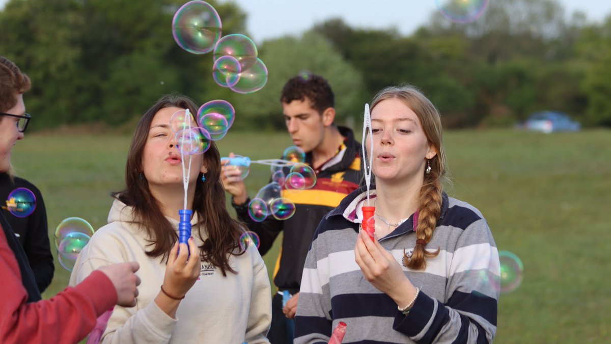 ShiplakeCollege's tweet photo. It was a beautiful morning as our #ShiplakeYear13 pupils made an early pilgrimage to Maidensgrove Common for #AscensionDay. We gathered to hear the Ascension story with some prayers, blowing bubbles for them to rise. This was then followed by a spirited game of #ShiplakeRounders https://t.co/5Wo6uIq1Qw