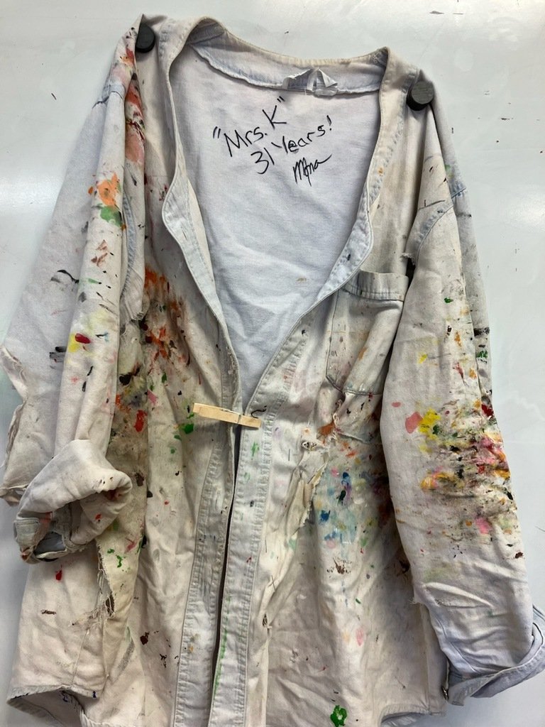Mrs. Kitchgatter hangs up her art shirt after 31 years. Congratulations, Mrs. K!