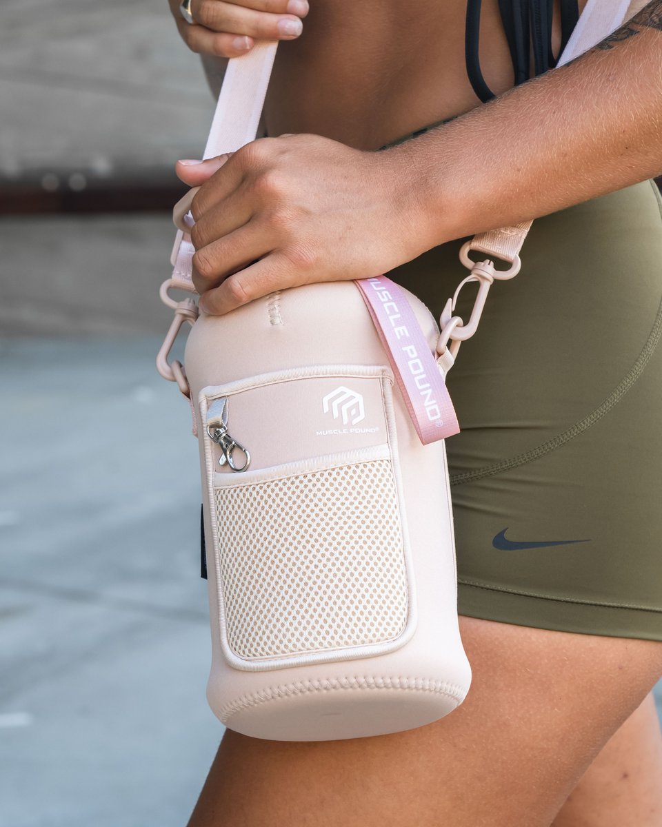 MusclePound's tweet photo. Stay chic and hydrated with our sleek 74 oz water bottle, complete with a fashionable sleeve! #musclepound https://t.co/v7SBOTCY5b