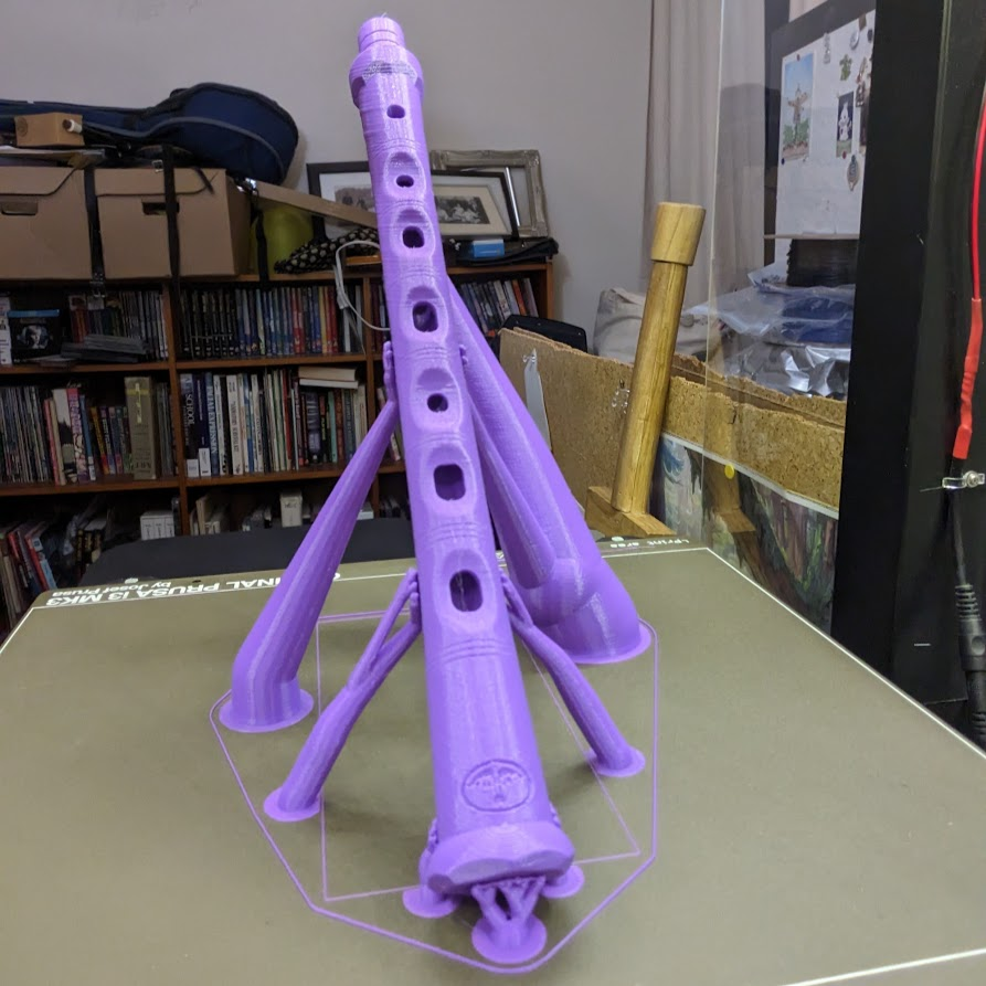 DavidHernston's tweet photo. I've wanted angled supports for a long time and #Prusa's new organic supports have finally made it possible. I put a block w/ 1 perimeter and no infill on the build plate to deflect the support bases. I think it has a lot of potential for stabilizing tall prints. #prusalive https://t.co/h4DROntXY7
