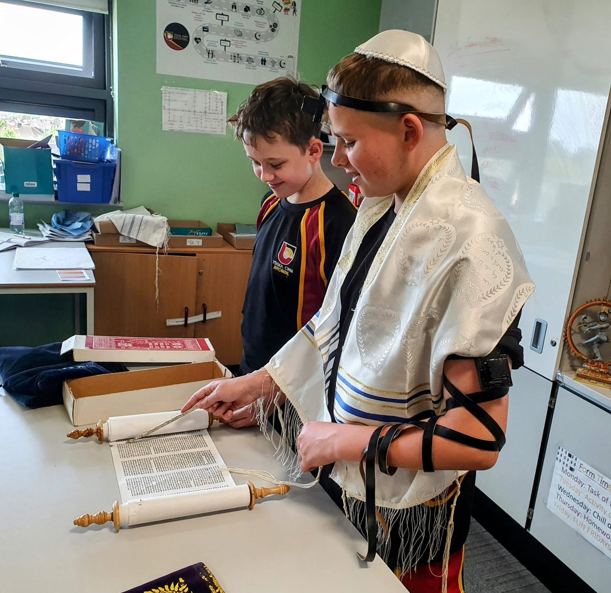 YCB_RS's tweet image. Currently year 8 are learning about Jewish life and customs. Today, Reagan and Osian demonstrated to the class items of Jewish dress and using a yad for the Torah. So far they are loving new cultures. @YCB_Year8