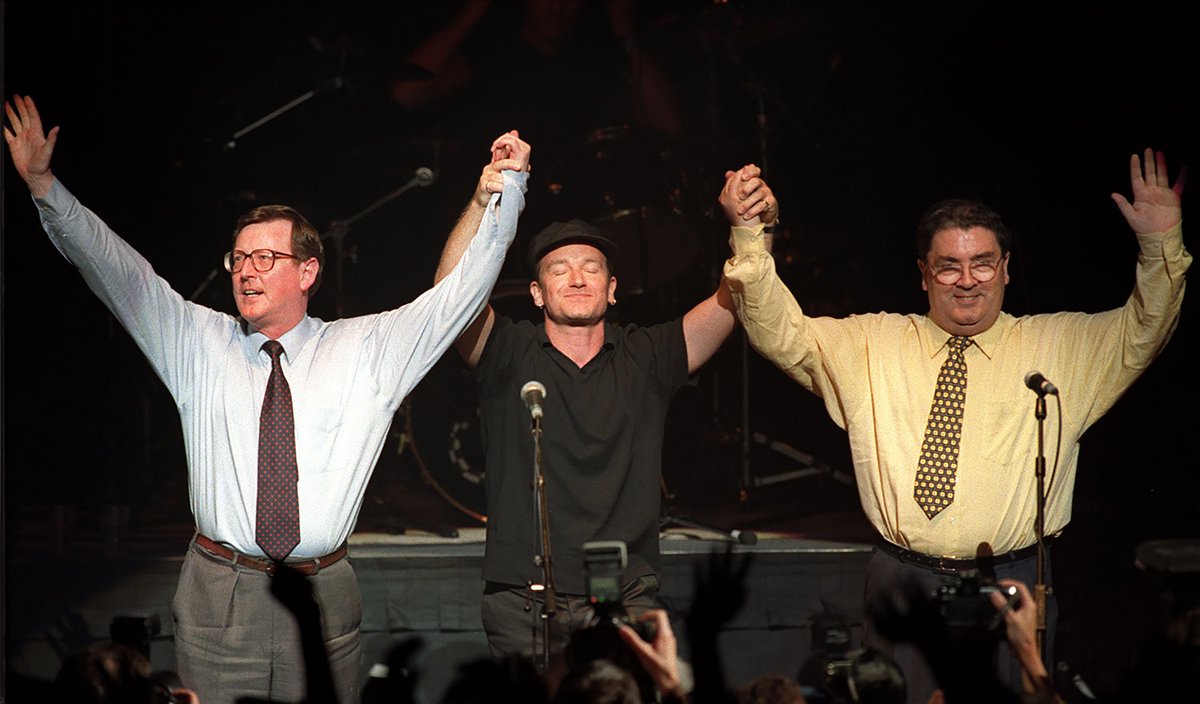 🎸 25 years ago today, @U2 took to the stage with David Trimble & John Hume at Belfast's Waterfront Hall for the 'Vote Yes' concert to boost support for the Belfast (Good Friday) Agreement.

🙌 Three days later the people of NI  & Ireland said 'yes' in the referenda! #BGFA25