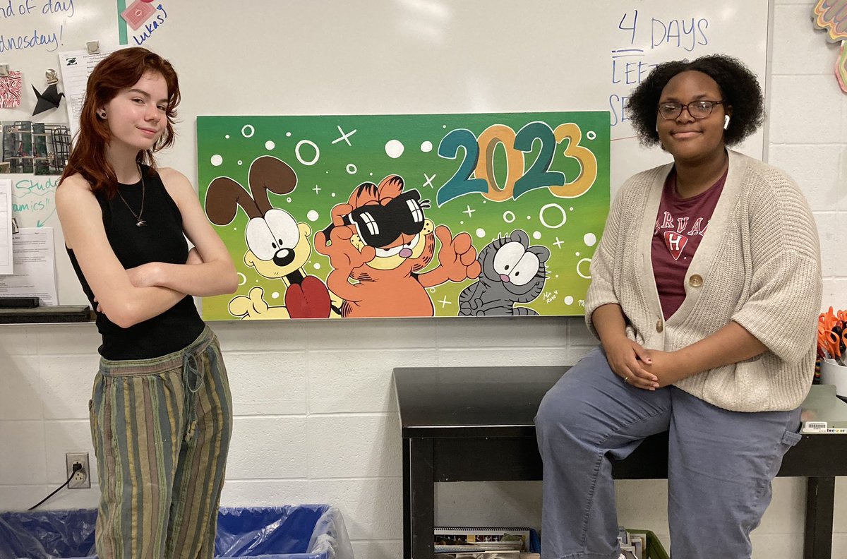 Maddie Franey and Mia Newsome put the finishing touches on the 2023 ceiling tile!