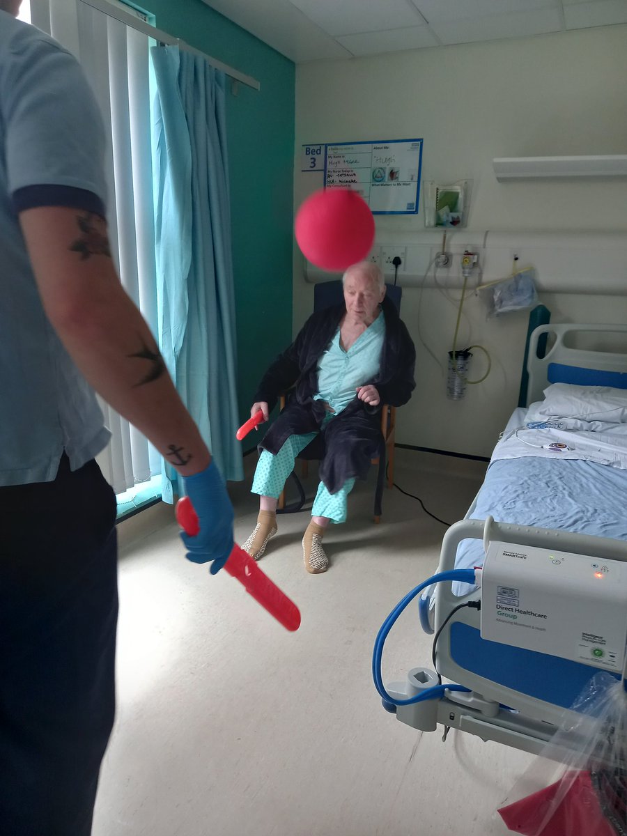AFU therapist playing balloon tennis with patients Hugh and Dan (permission granted for publication of photos) as part of our Dementia awareness week celebrations to encourage active movement #getupgetdressedgetmoving