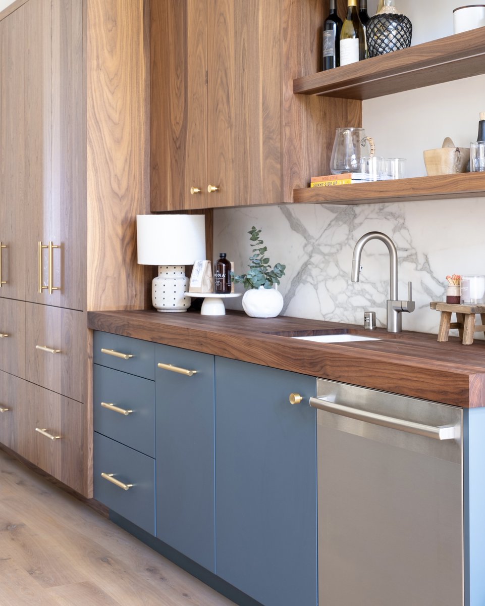 We’re not afraid of mixed materials over here at GRD. This kitchen, primarily designed with walnut cabinetry, needed a pop of color and we came through with this cool blue creating the perfect spot for making cocktails and gathering with friends!