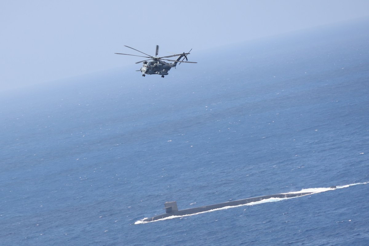 Surface for supplies. ⚓ 🇺🇸 
#NavyReadiness 

The #USSMaine (SSBN 741) surfaces to receive a vertical replenishment from @USMC, Marine Heavy Helicopter Squadron (HMH) 462, 1st Marine Aircraft Wing, III Marine Expeditionary Force, in the Philippine Sea, May 9, 2023.