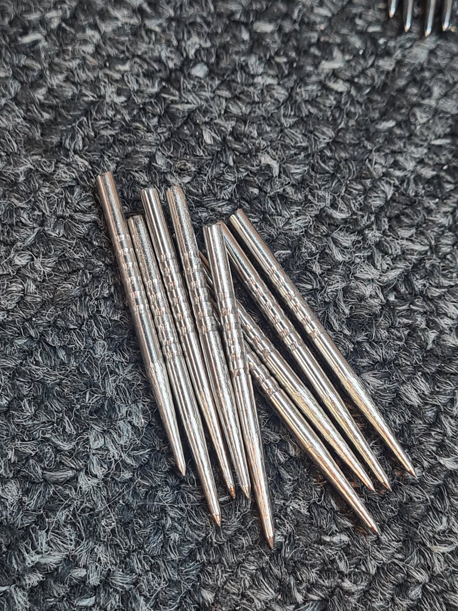 EagleDarts1's tweet photo. We can make custom grooved points, too.

Stage one is machining the grooves.

The silver are for @MattDoe8 
The black Swiss for @ZacGriffiths180 https://t.co/JggkpLzLjF