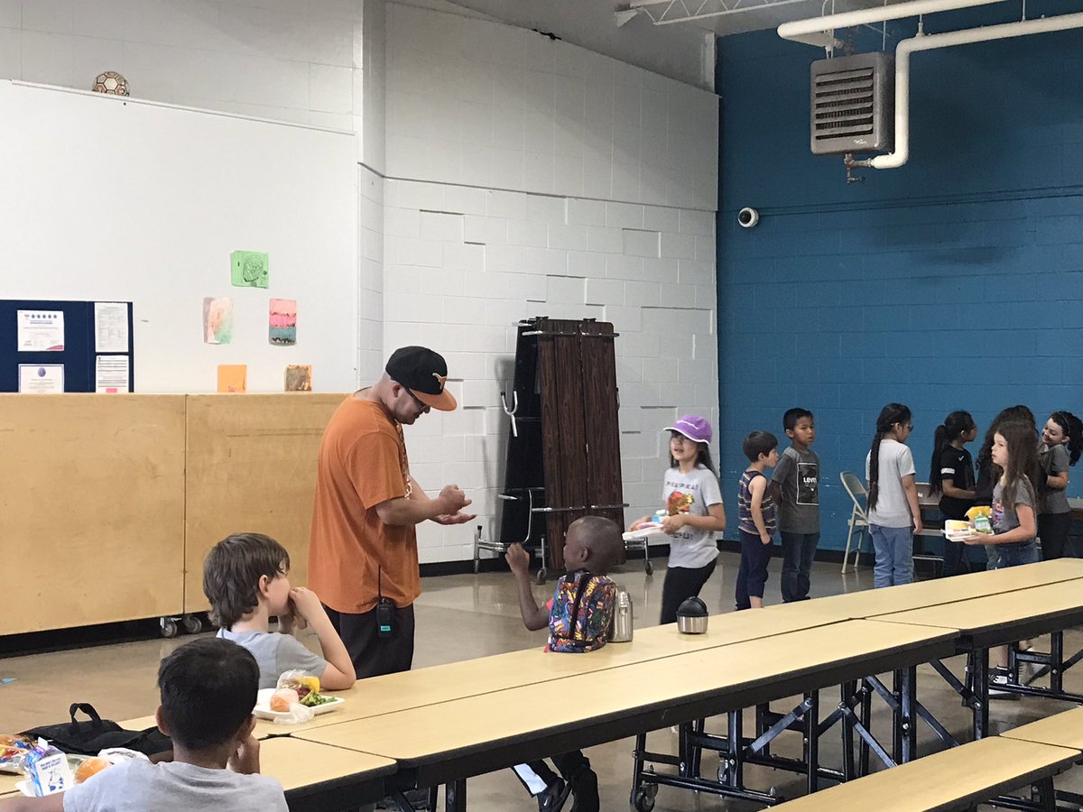 Our custodian, Mr. Gabe playing rock, paper, scissors with one of our roadrunners during lunch! #togetherwearebetter @APSLZ4 @chris_zone4