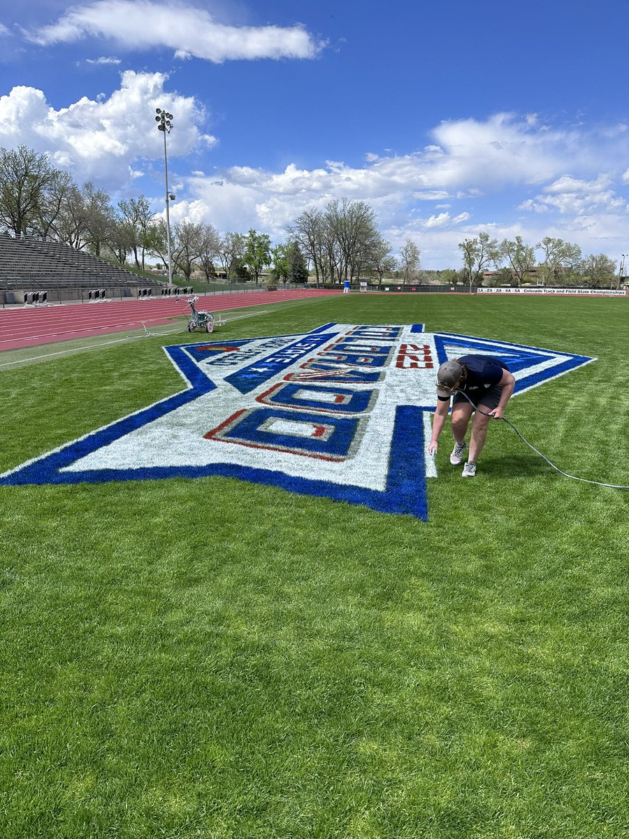 SportsTurfSun's tweet photo. Wild week! Colorado has been getting amazing rain, we’re nearing 5 inches in the past week. Painted a logo for the State track meet at a different stadium and did my best @bermuda419s impression on the outline! Today and tomorrow, hosting 4 graduations at the #bestoffice #crewof2 https://t.co/QwjEW17UlU