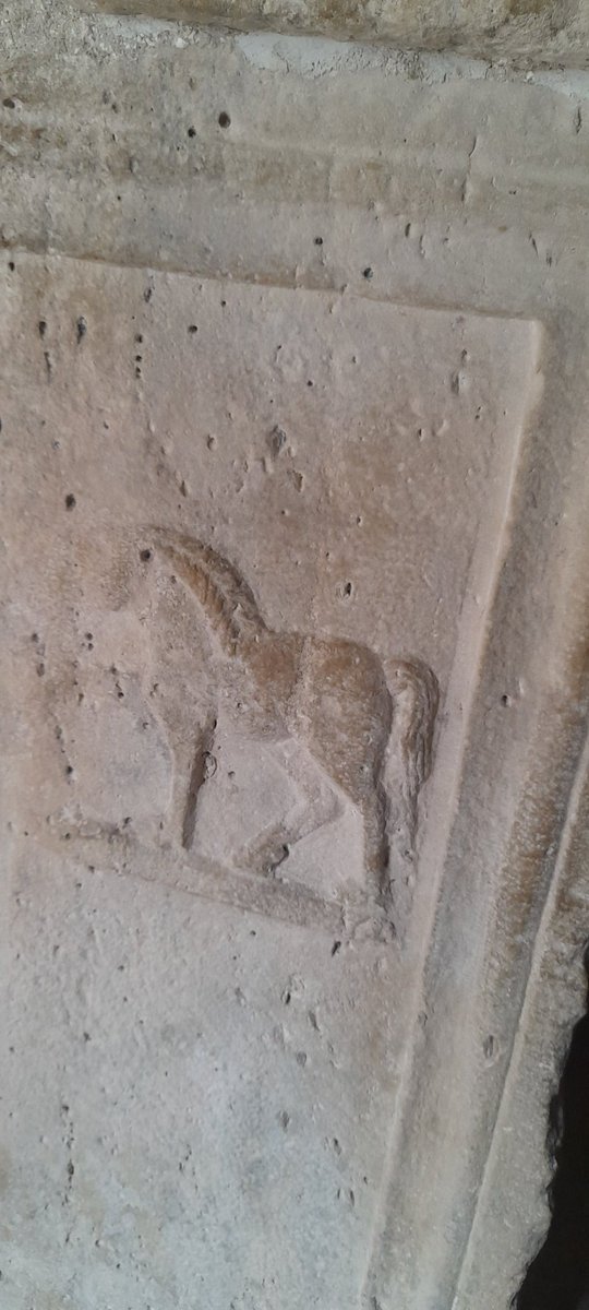 Two of the horses from the column bases inside the church of St Nicholas at Densus in Romania