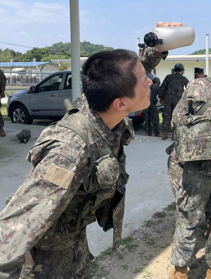 uarmyvibe's tweet photo. [Official Training Sketch]
Hobi is in his last week of training. They had intense 화생방(CBRN-Chemical, Biological, Radio, Nuclear ) training on 5/18. 

The first photo is washing tear gas off eyes with water &amp; second one is an exercise to shake off chemicals after the training https://t.co/aArl0hqqyZ