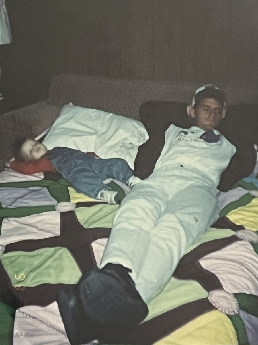 catfan28's tweet image. #ThroughBackThursday - After selling nearly 1,000 Cough Up A Hawker t-shirts during K-State Homecoming of 1991… I was too tired to celebrate beating KU that October day and took a nap with my nephew.