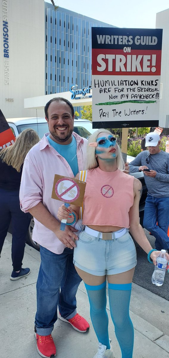 DannyManus's tweet photo. Today's WGA #TransTakeover event at Netflix was incredible! So great to see so many trans, nonbinary, queer &amp; gay talent marching &amp; serving! Saw some folks I havent seen in years, finally met some twitter folks IRL, my bf killed the "Look" category &amp; y'all check my sign... https://t.co/lXbhAIVcyx