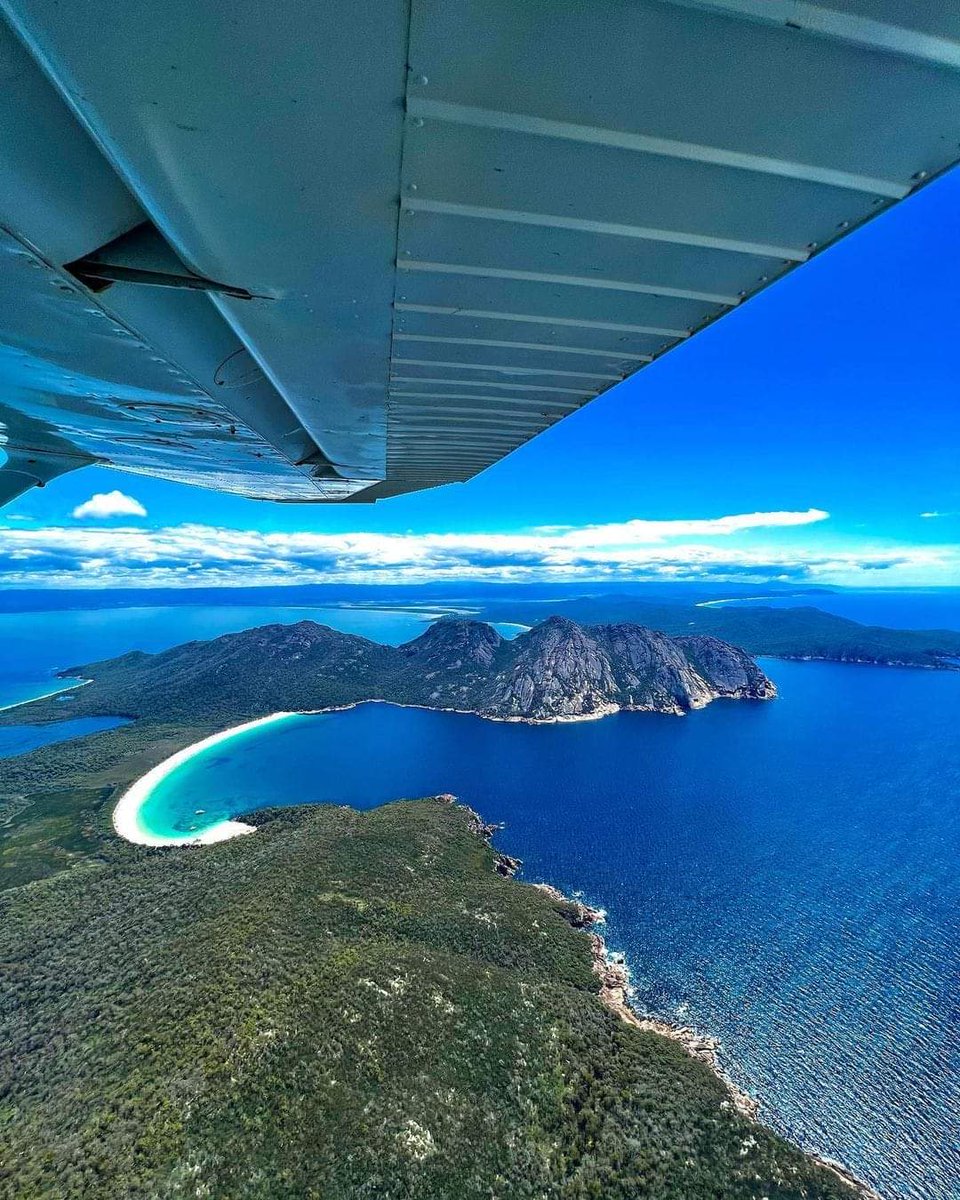 A pretty special aerial view of our iconic Wineglass Bay and the Freycinet Peninsula 🌊🏞 pic: instagram.com/tasmanianlands…