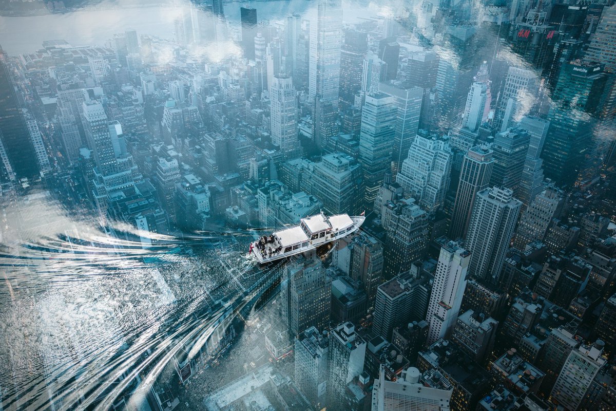 EditzStation's tweet photo. Boat over city. https://t.co/bhqSeRpSpK